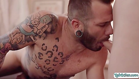 Sexy masseuse giving a deepthroat foot massage to client