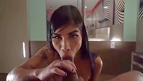 Painted and tattooed brunette and her interracial partner